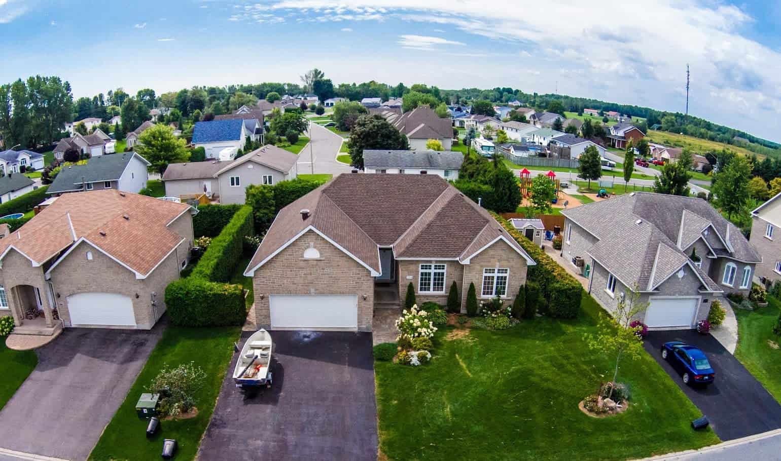 A neighborhoods roof Drone view of multiple homes
