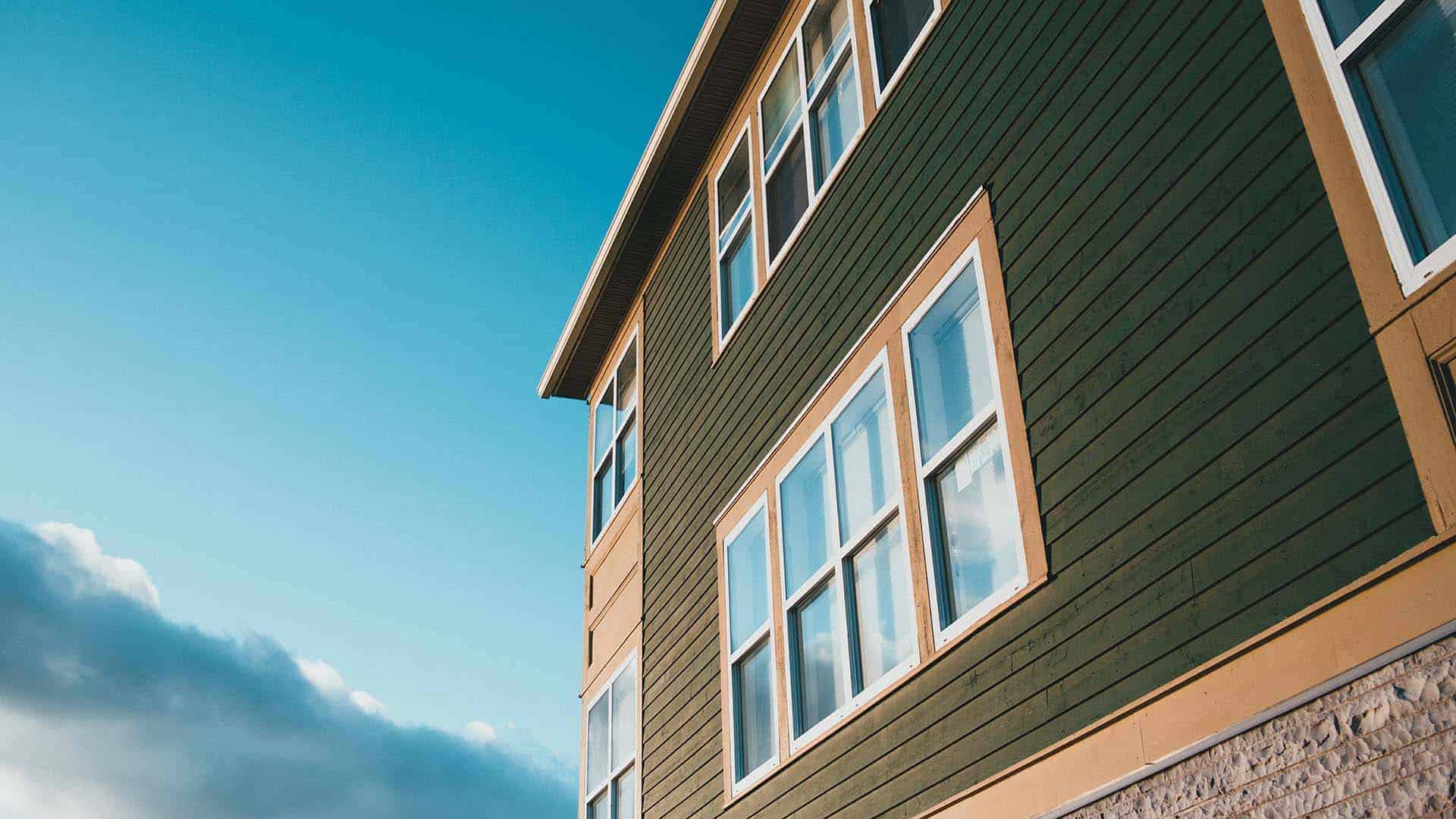 Side of home in Minneapolis after roof installation by Minneapolis roofing company.