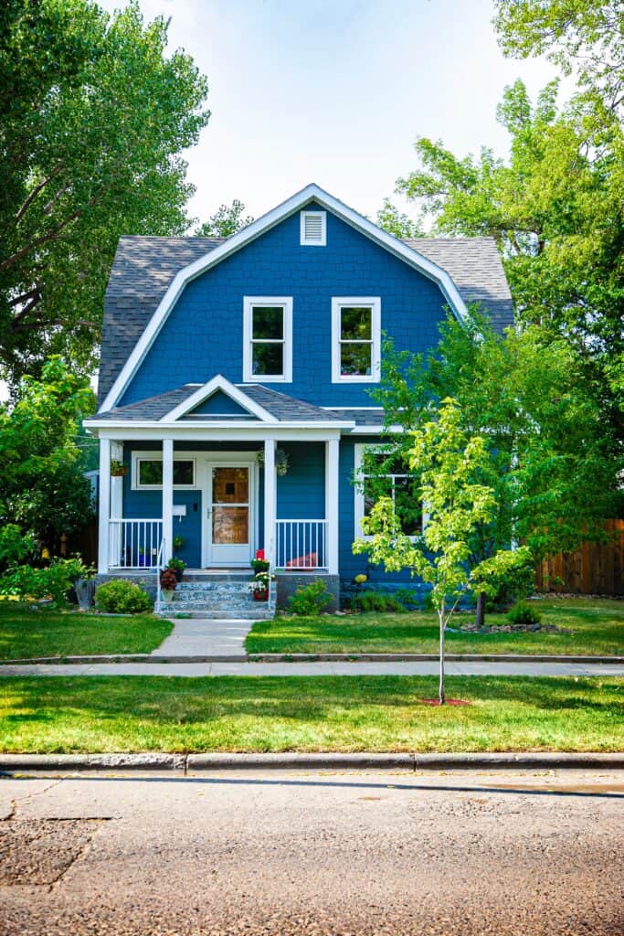 House in Charlotte with bright blue siding from charlotte roofing contractor