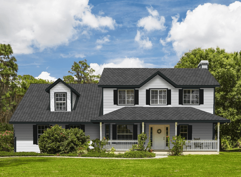 Front of house with white siding and black roof and black gutters in Charlotte, NC