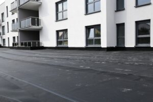 A commercial building with an EPDM roof installed by a Charlotte professional contractor.