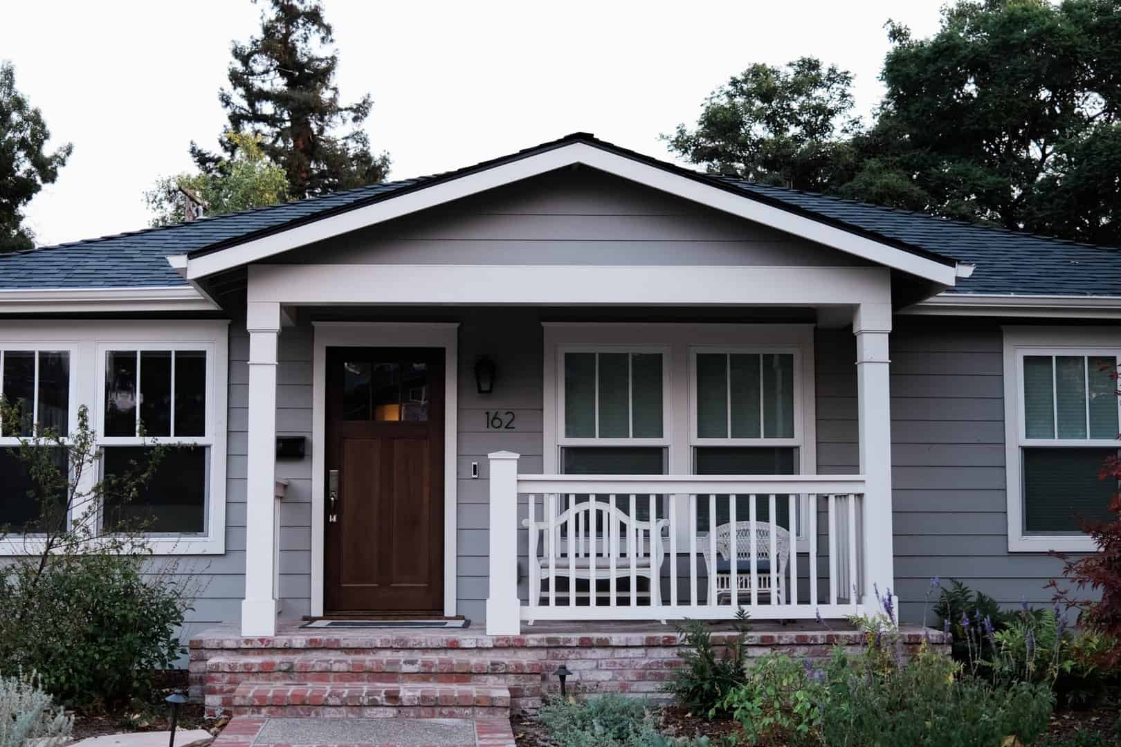 house with newly covered front porch from Charlotte roofing company, done the canopy roofing way