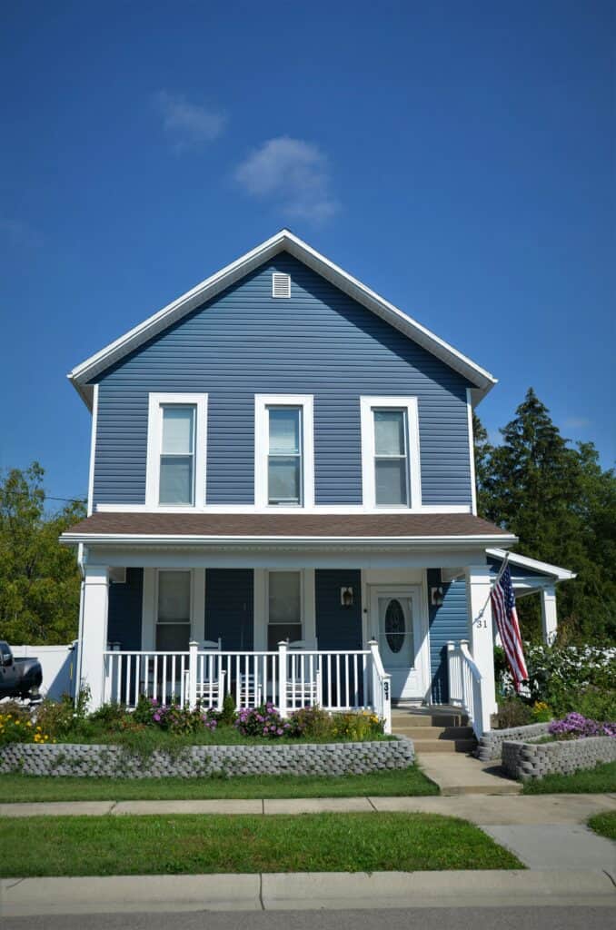 A Charlotte home with blue vinyl siding installed by a Charlotte siding contractor.
